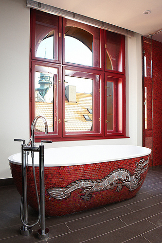red mosaic bathroom with tiled tub