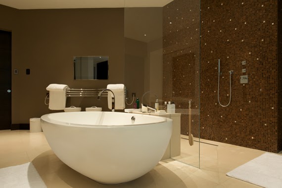 mosaic bathroom with free standing bathtub