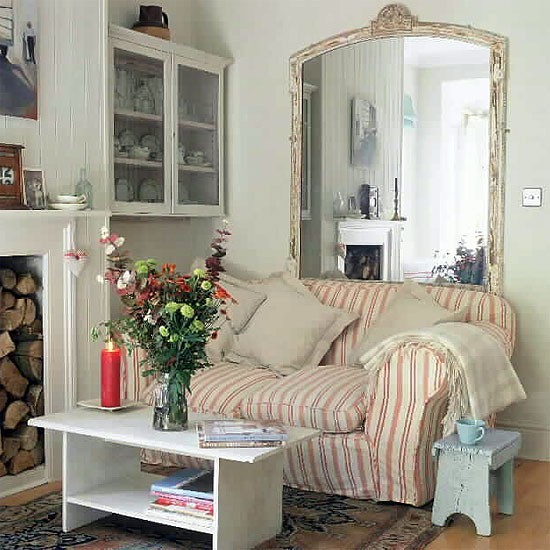 small living room with fireplace and large mirror