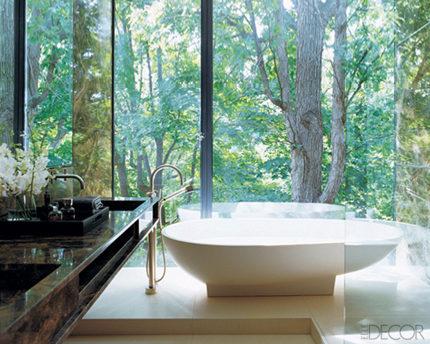 bathroom with forest view by Yabu Pushelberg