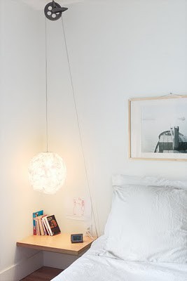 Bedside pendant hanging from clothesline pulley