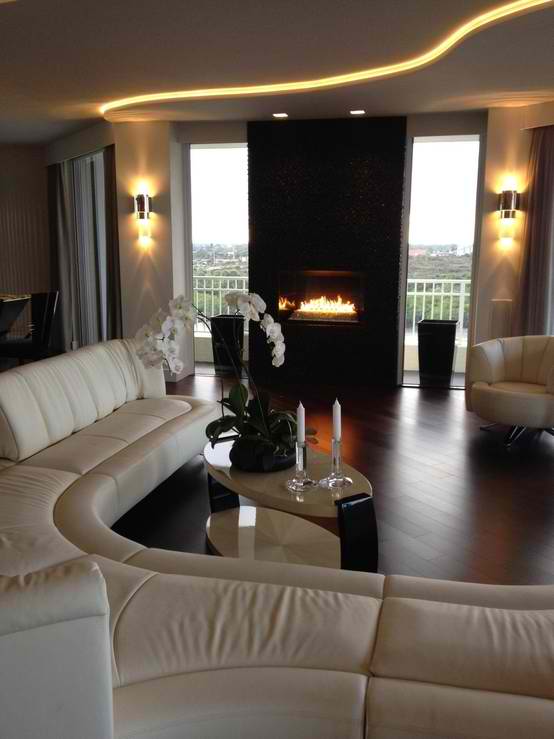 contemporary living room design with white sofa and black fireplace