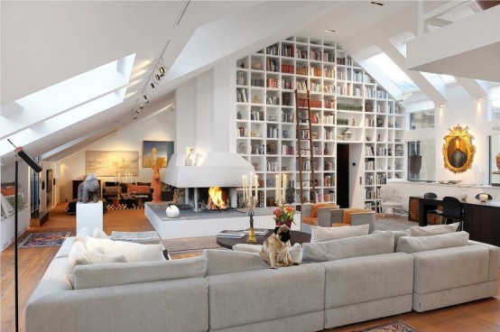 contemporary living room with amazing library and fireplace