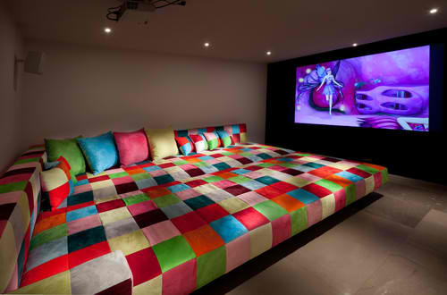 home theater room with king size colorful sofa