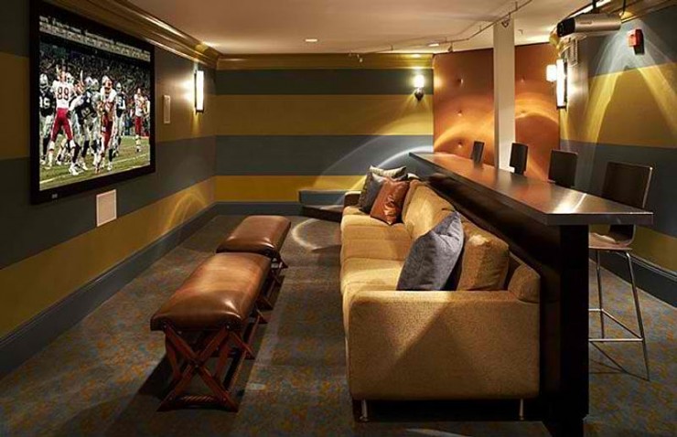 home theater with sofa and stand