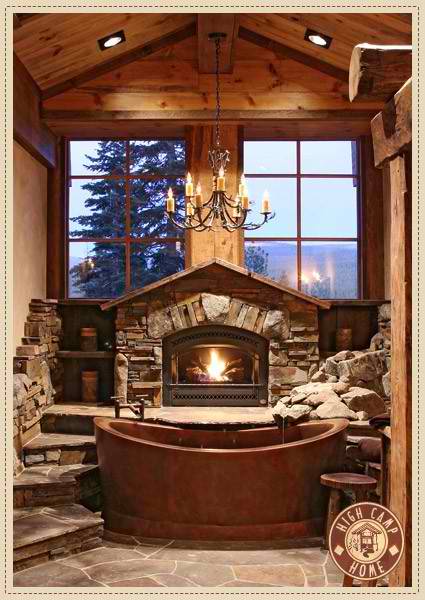 stone bathroom design with view fireplace and chandelier