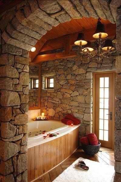 raw stone and wood bathroom design