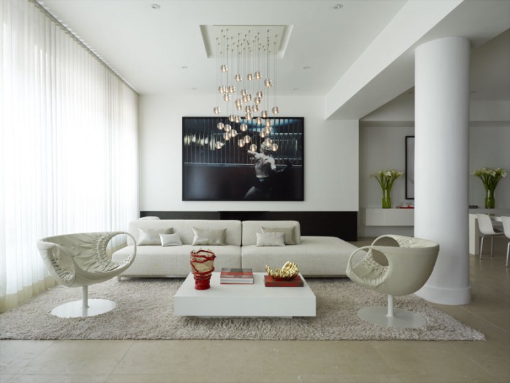 white minimalist living room with black wall art