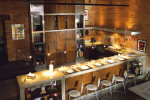 stainless concrete kitchen with brick walls