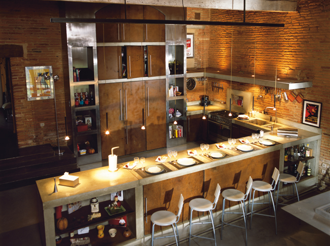 stainless concrete kitchen with brick walls