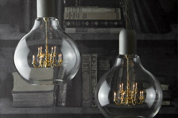 chandelier suspended inside a glass lightbulb
