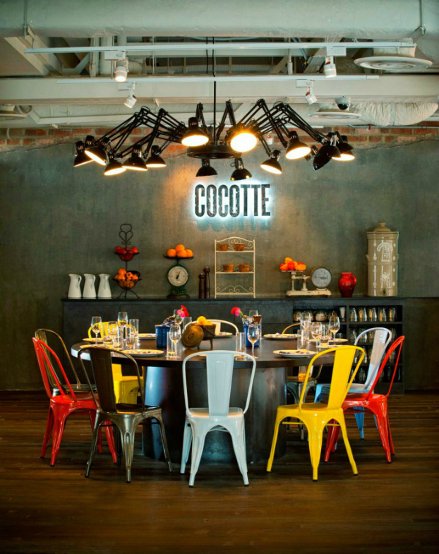 industrial dining room with colorful chairs