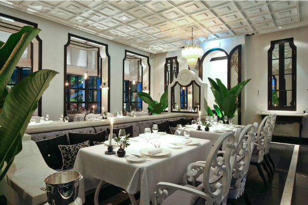 elegant traditional dining room decorated with large mirrors