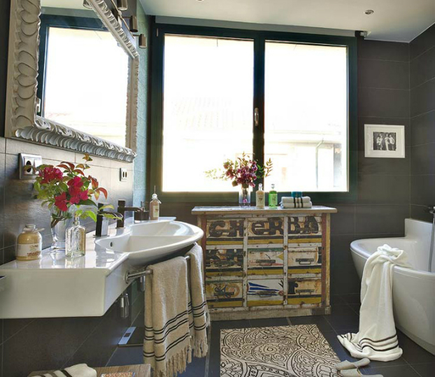 modern bathroom with antique 2 furniture and black tiles