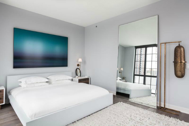 white bedroom with contemporary art
