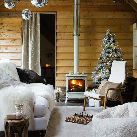 Christmas living room country decorating idea with stove and tree