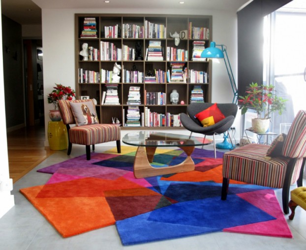 living room with bold colorful carpet
