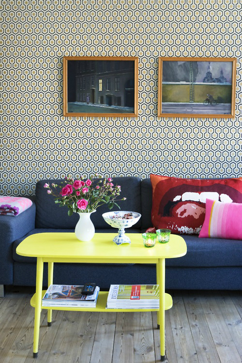 living room with bold yellow coffee table