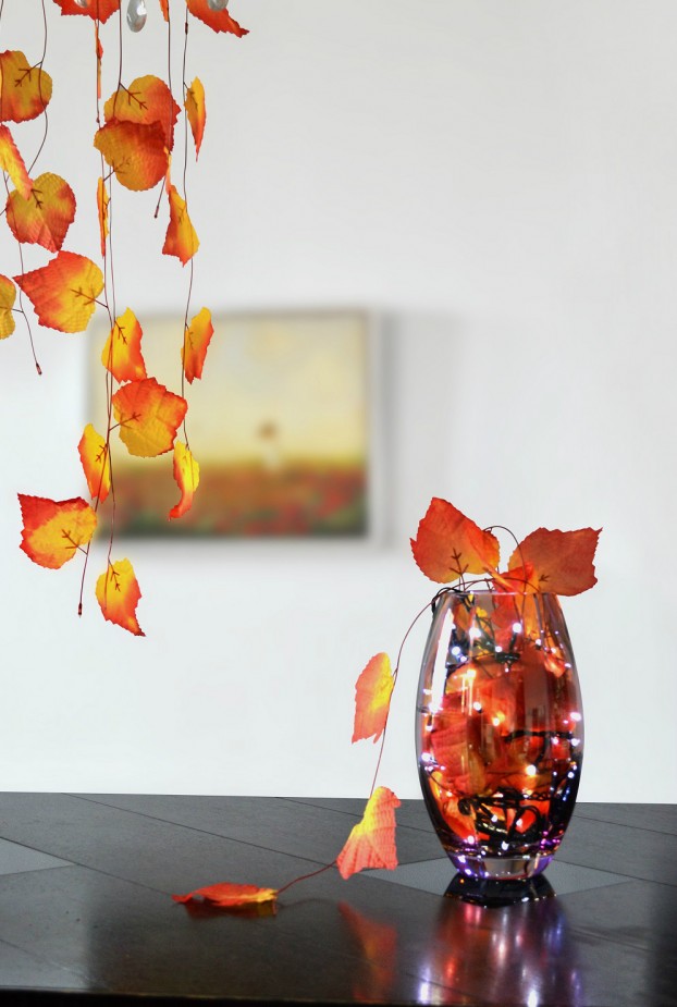 thanksgiving table decoration with leaves and fairy lights