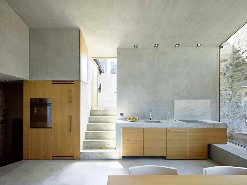 light woof contemporary kitchen with concrete wall 2