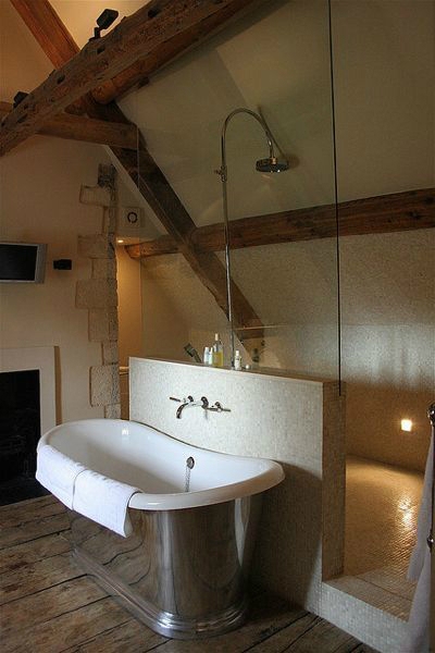 wood elements in bathroom with bathtub