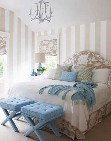 romantic small low ceiling bedroom with stripes