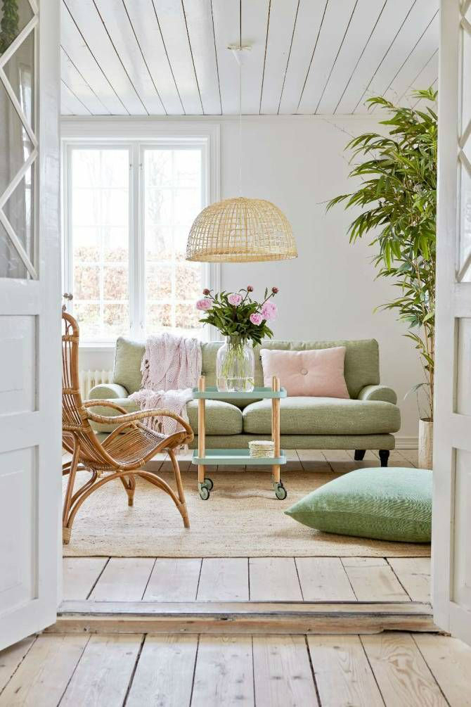 living room with white walls and light green pistachio sofa