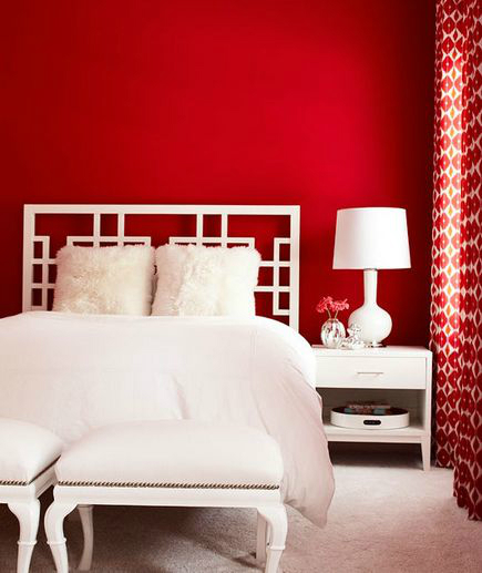 red wall and white bed bedroom