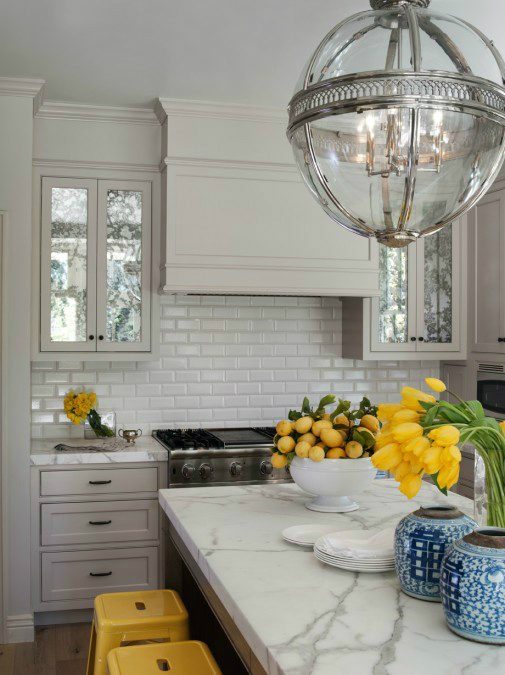 gray kitchen with yellow tulips and lemons decorations