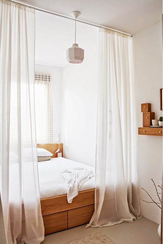 window shades that are closer to the ceiling will make your bedroom feel and appear taller