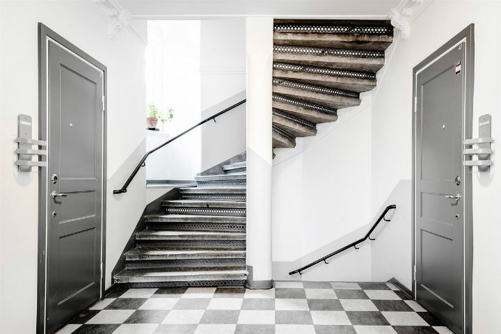 old Scandinavian staircase and black and white tiles