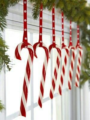 Hang candy canes in kitchen window