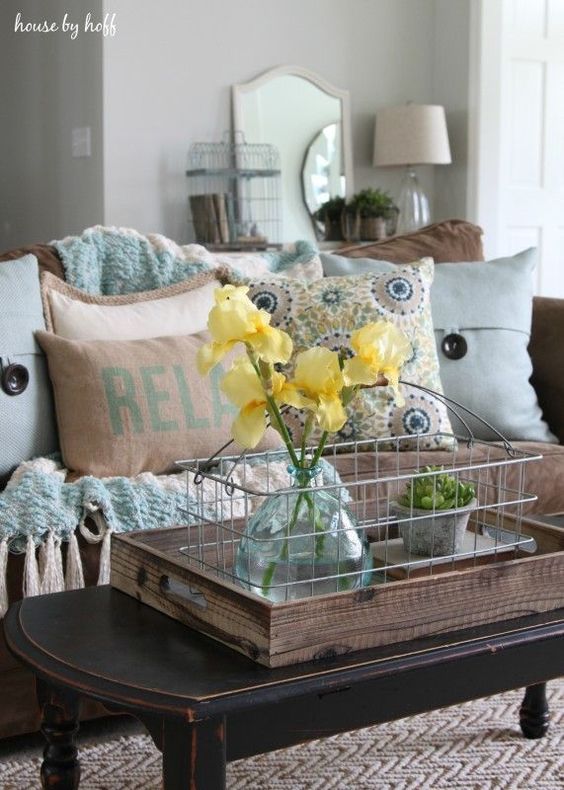 light blue and brown living room with yellow flowers
