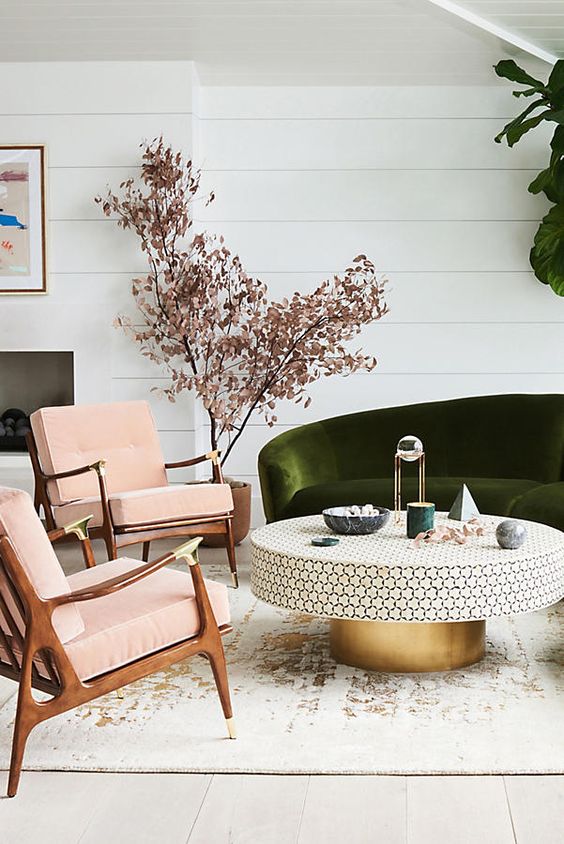 modern blush pink and green living room with velvet sofa