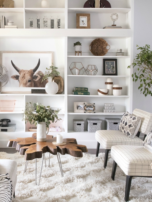 white living room with great shelves styling