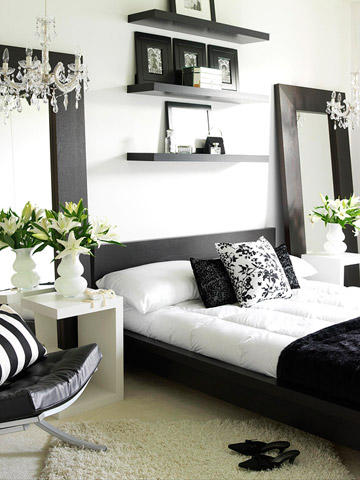 contemporary black and white bedroom with chandelier