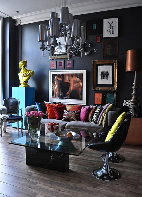 modern living room with black wall and colorful decor