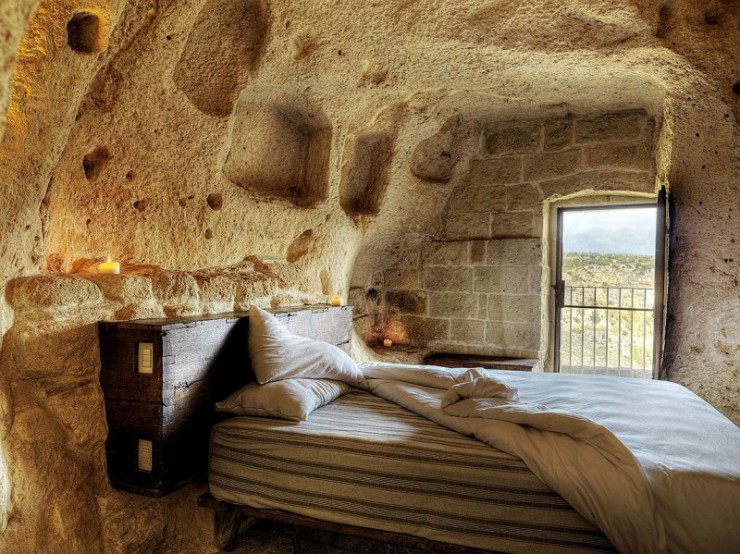 hotel into limestone caves in Italy 9