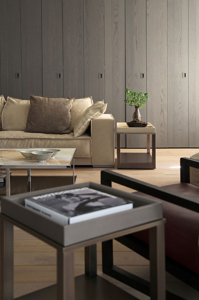 contemporay living room with hidden shelves kolonaki house by esse