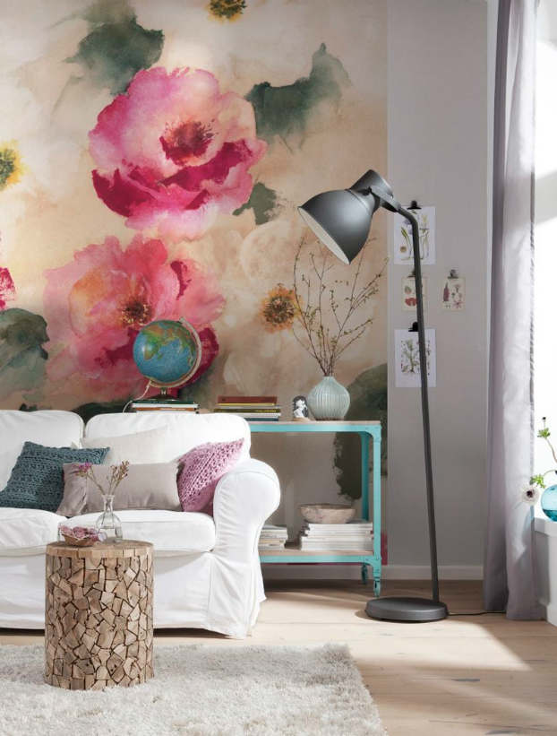 white sofa and a painting with flowers