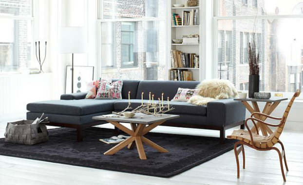 dark grey sofa and a wood table