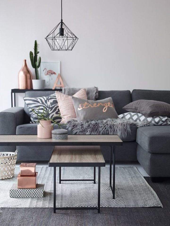 living room idea with dark gray sofa with copper and blush