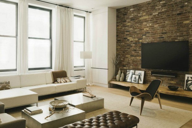 industrial living room with brick wall oak TV shelf and white sofa