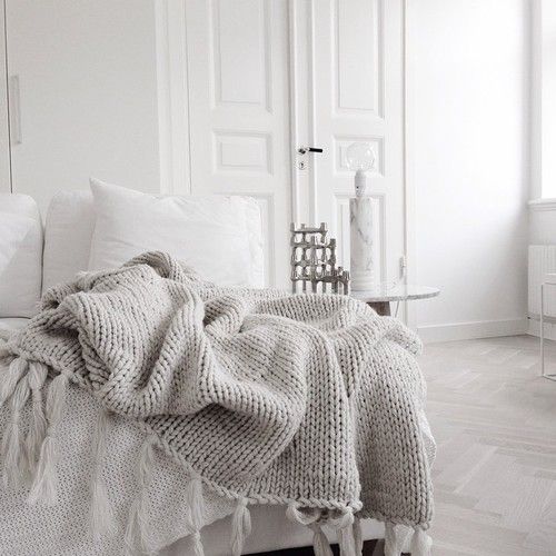 simple bedroom with gray rug throw