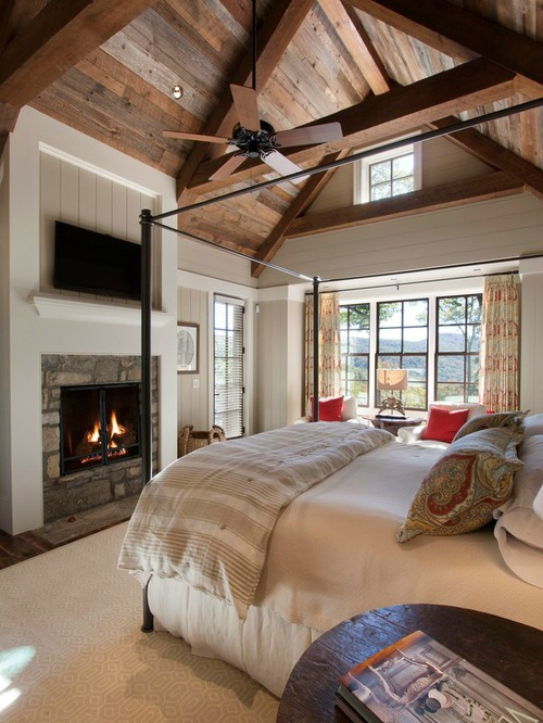 fireplave in bedroom with exposed beams