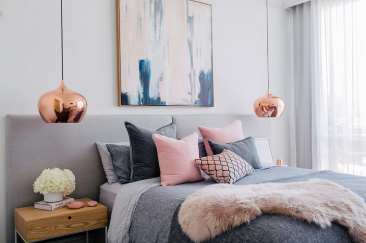 gray and pink bedroom with copper lights