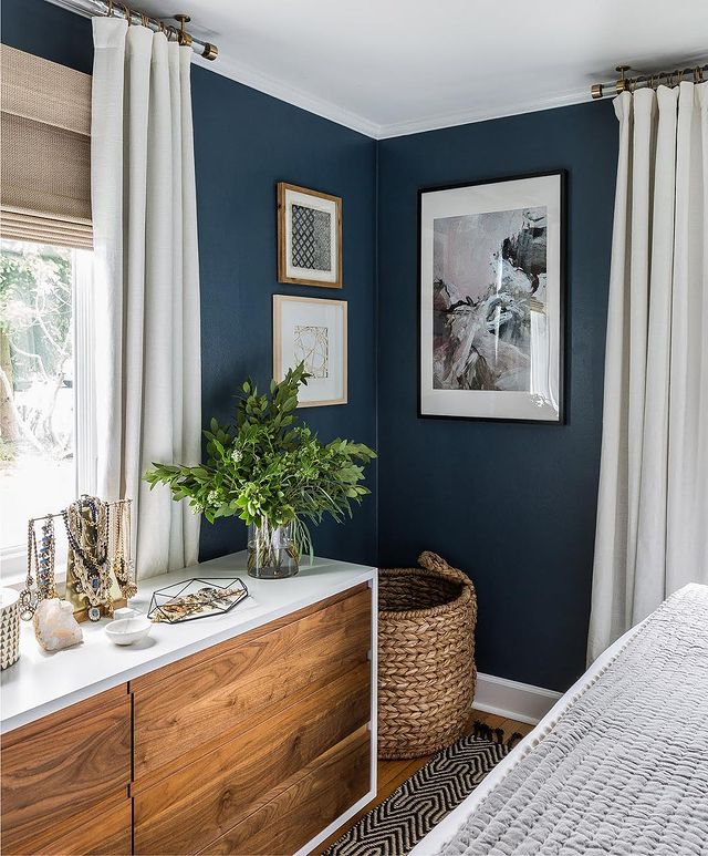 bedroom with dark blue paint color