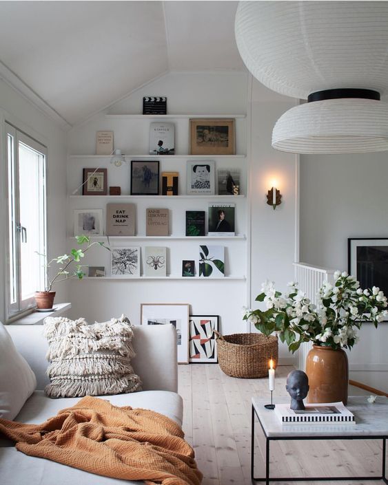 white couch and decorative shelves