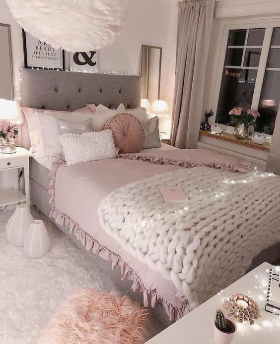 double bed near window with pink and grey colors 