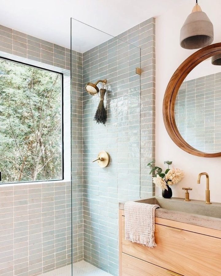 light-blue-walk-in-shower-with-gold-fixtures
